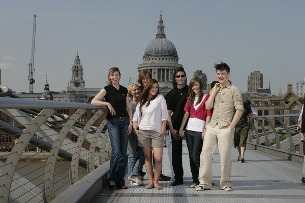 Tour director, teacher and students together on educational tour Tour director, teacher and students together on educational tour