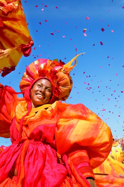 A woman dances in festive garb